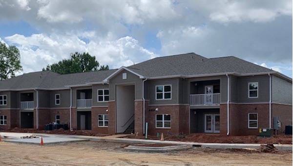 Wealth Watchers new construction of the Woodlands Apartments. Under construction in May 2020.